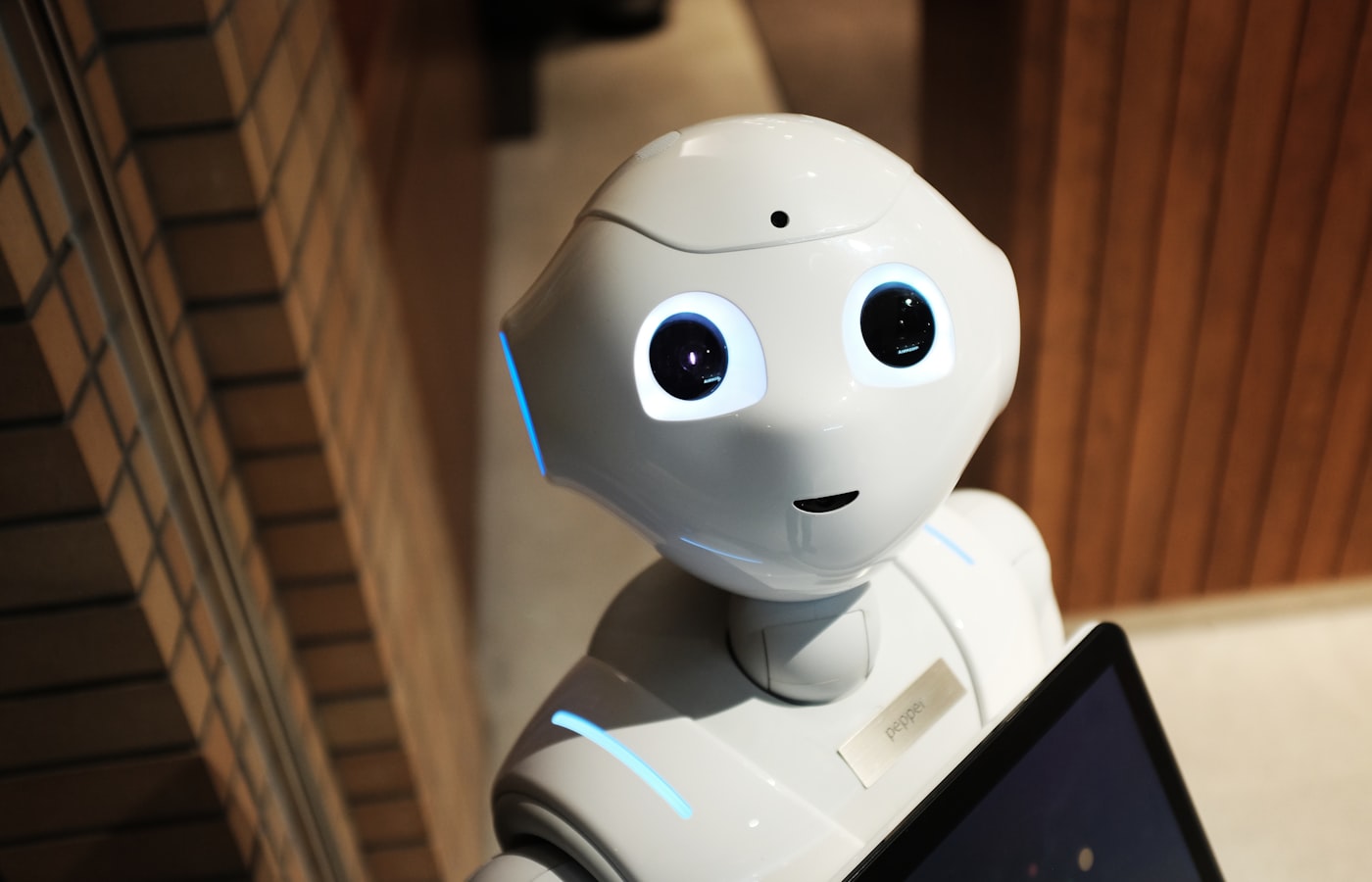White robot representing practical AI applied to real work